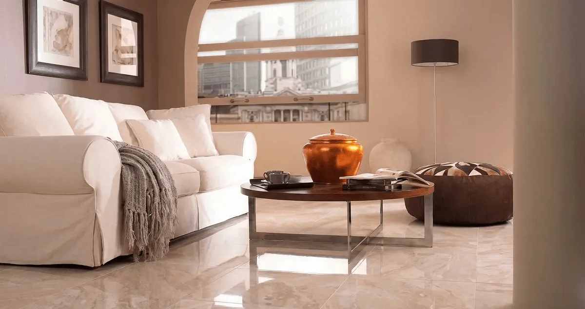 Modern living room with professionally installed marble flooring, a beige sofa, coffee table in St Paul, MN
