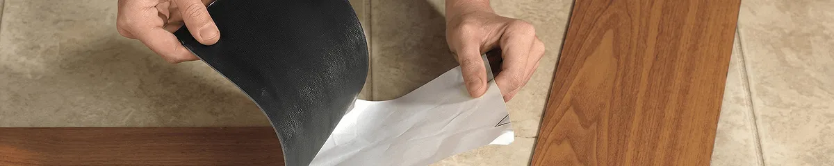 A professional installing vinyl flooring in St Paul, MN